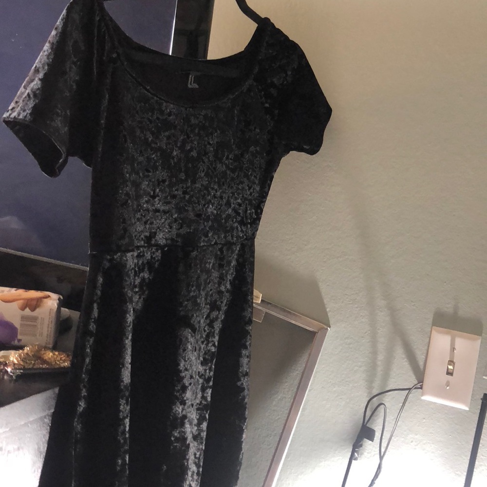 A black velvet skater dress worn twice